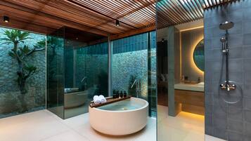 Separate bathtub and shower, free toiletries, hair dryer, slippers