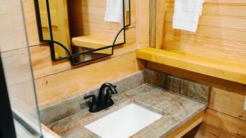 Shower, towels, soap, toilet paper