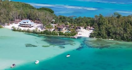 Waterfront home with private beach, a private pool, and water activities! Moku