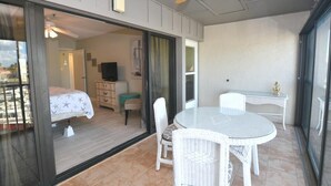 A room with a bed, a desk, a chair, and a ceiling fan. - Beautiful marina view in the Keel Club @ Burnt Store Marina and Country club (Punta Gorda)