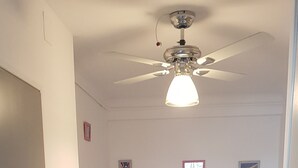 A bedroom with a bed, a ceiling fan, and a door. - Vue Exceptionelle ! Mer-port- Esplanade Oniria ! (Canet-en-Roussillon)