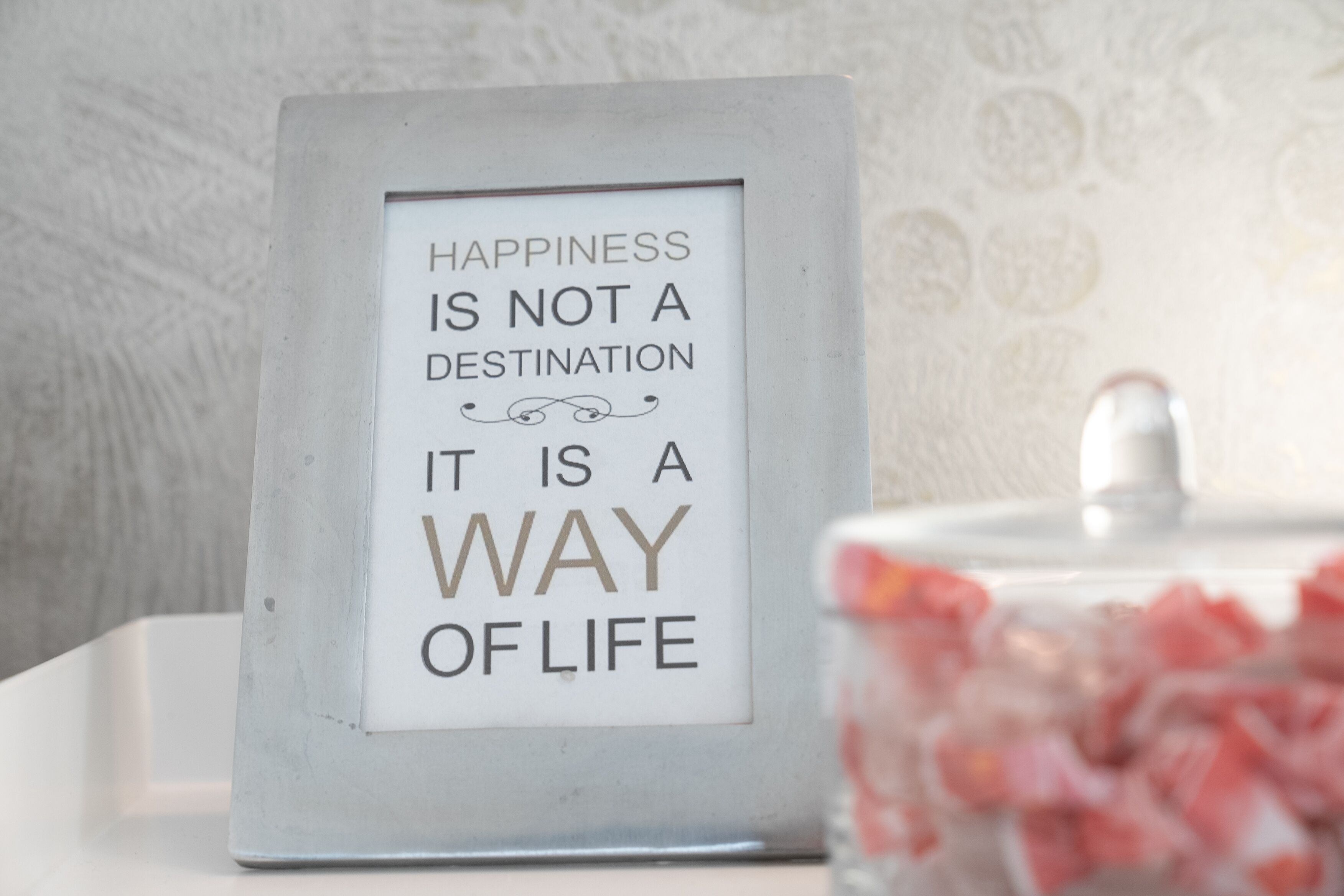 A framed quote on a wall.