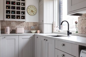 Microwave, dishwasher, coffee/tea maker, toaster