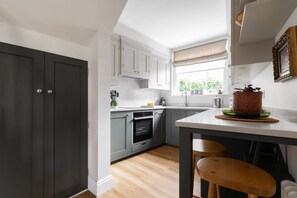 Dishwasher, coffee/tea maker, toaster, dining tables