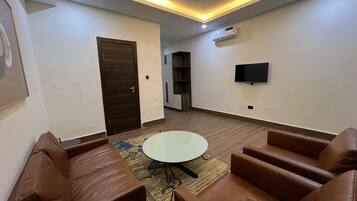 Luxury Studio Suite | Living area | 43-inch Smart TV with digital channels, Netflix, streaming services