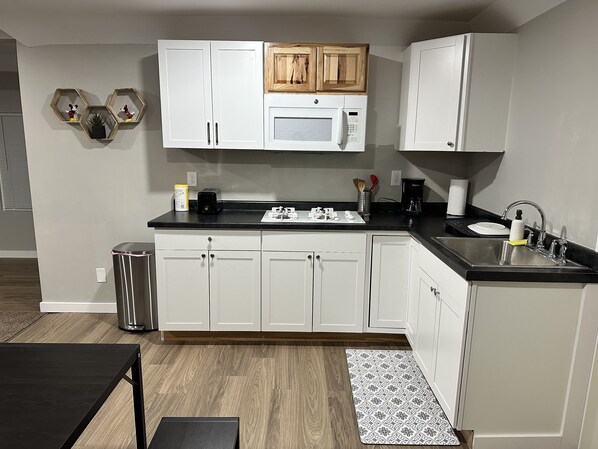 Microwave, stovetop, dishwasher, coffee/tea maker