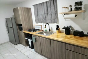 Fridge, microwave, stovetop, coffee/tea maker