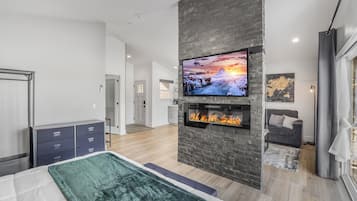 1 bedroom, desk, iron/ironing board, travel crib