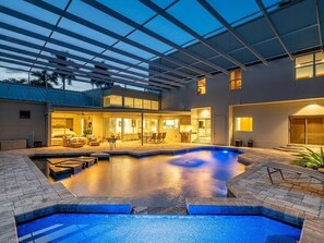 Relax by the pool surrounded by a spacious deck and comfortable seating areas.