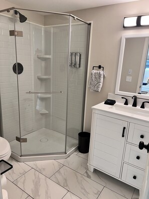 Shower, hair dryer, towels, soap