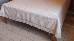 A bedroom with a bed, a nightstand, a lamp, a wardrobe, and two framed pictures on the wall. - Les Cadoles - Cortevaix (CORTEVAIX)