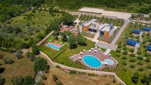 An aerial view of a resort with multiple buildings, a large swimming pool, and surrounding greenery. - Amazing home in Vodnjan with private swimming pool, can be inside or outside (Vodnjan)