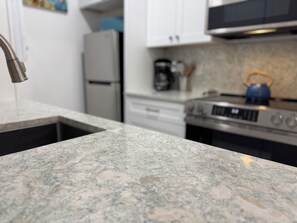 Fridge, microwave, oven, stovetop - Waterfront Building 1st Floor, Pools, Beach Items. Just Renovated.  (Madeira Beach)