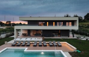 A modern two-story house with a swimming pool, outdoor seating, and a well-maintained garden. - Stunning home in Labin - Rabac (Labin - Rabac)