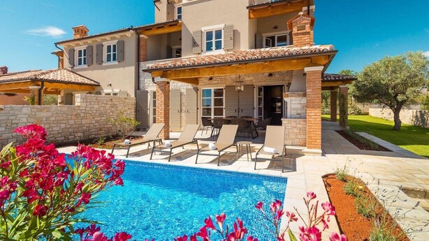 A two-story house with a swimming pool, outdoor seating, and a garden. - Awesome home in Porec (Porec)