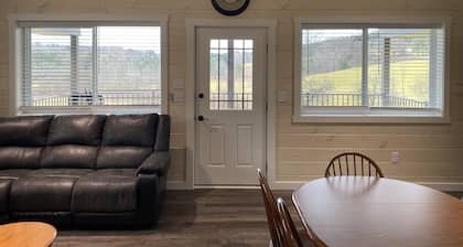 Family friendly cottage, covered deck, close to lake to fish, swim, and boat