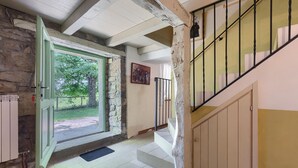 A staircase leading to a landing with a view of a garden. - Stunning home in Buzet (Buzet)