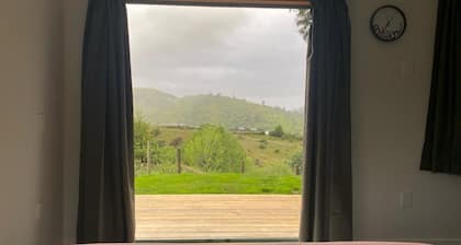 Commune with Nature at Hilltop View in Nikau Valley!