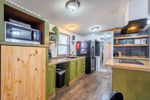 Fridge, microwave, stovetop, coffee/tea maker