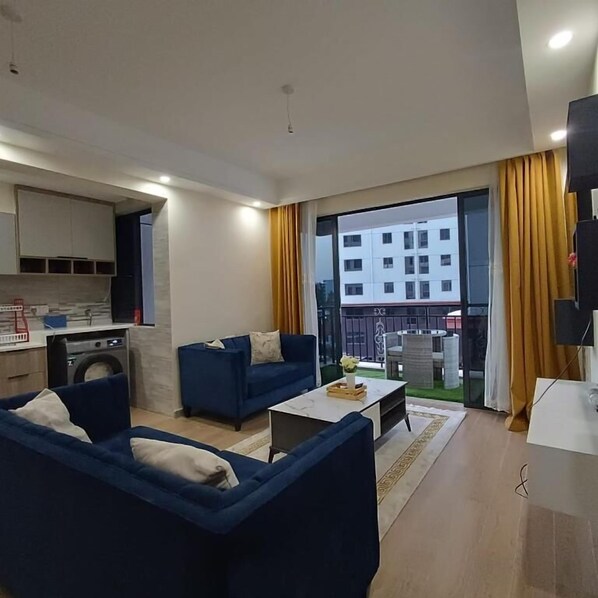Business Apartment | Living area | 24-inch Smart TV with satellite channels - Lux Suites Siaya Park Apartments (Nairobi)
