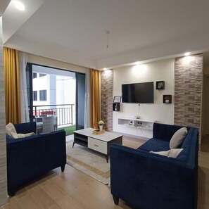 Business Apartment | Living area | 24-inch Smart TV with satellite channels - Lux Suites Siaya Park Apartments (Nairobi)