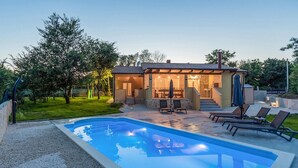 A house with a swimming pool, outdoor seating, and a patio area. - Pet friendly home in Debeljuhi (Debeljuhi)