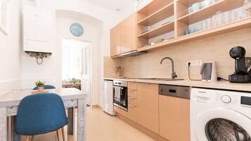 Classic Apartment | Private kitchen | Mini-fridge, stovetop, dishwasher, coffee/tea maker