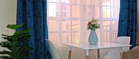 Elite Apartment | Living area | 24-inch Smart TV with satellite channels