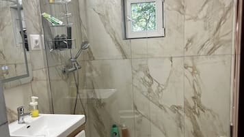 Shower, hair dryer, towels, soap