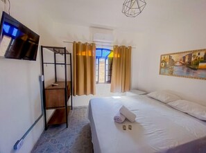 Habitación cuádruple superior | 1 habitación y ropa de cama 