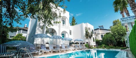 Seasonal outdoor pool, open 8:00 AM to 7:00 PM, pool umbrellas