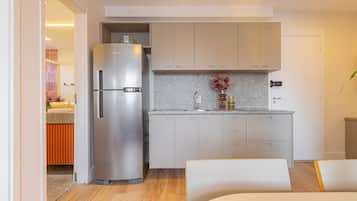 Fridge, microwave, coffee/tea maker, cookware/dishes/utensils