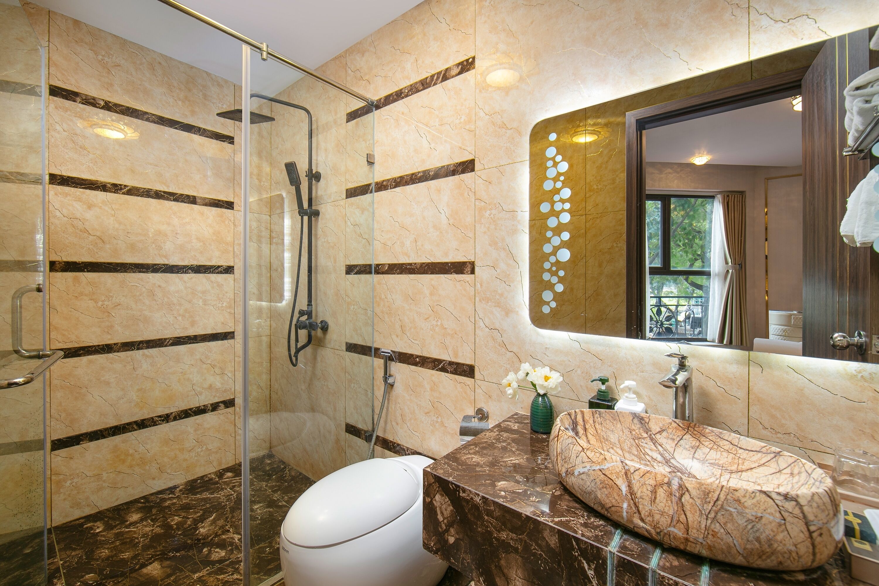 Separate tub and shower, rainfall showerhead, designer toiletries