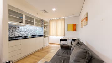 Comfort Apartment | Living area | 26-inch plasma TV with digital channels