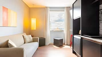 Comfort Apartment | Living area | 26-inch plasma TV with digital channels