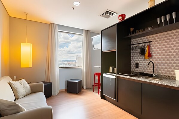 Comfort Apartment | Living area | 26-inch plasma TV with digital channels