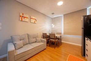 Comfort Apartment | Living area | 26-inch plasma TV with digital channels