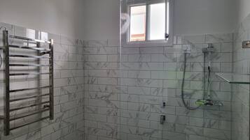 Shower, hair dryer, towels, soap