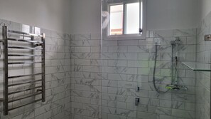 Shower, hair dryer, towels, soap