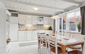 Fridge, stovetop, dishwasher, coffee/tea maker