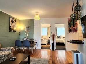 City Apartment | Living area | 55-inch Smart TV with digital channels