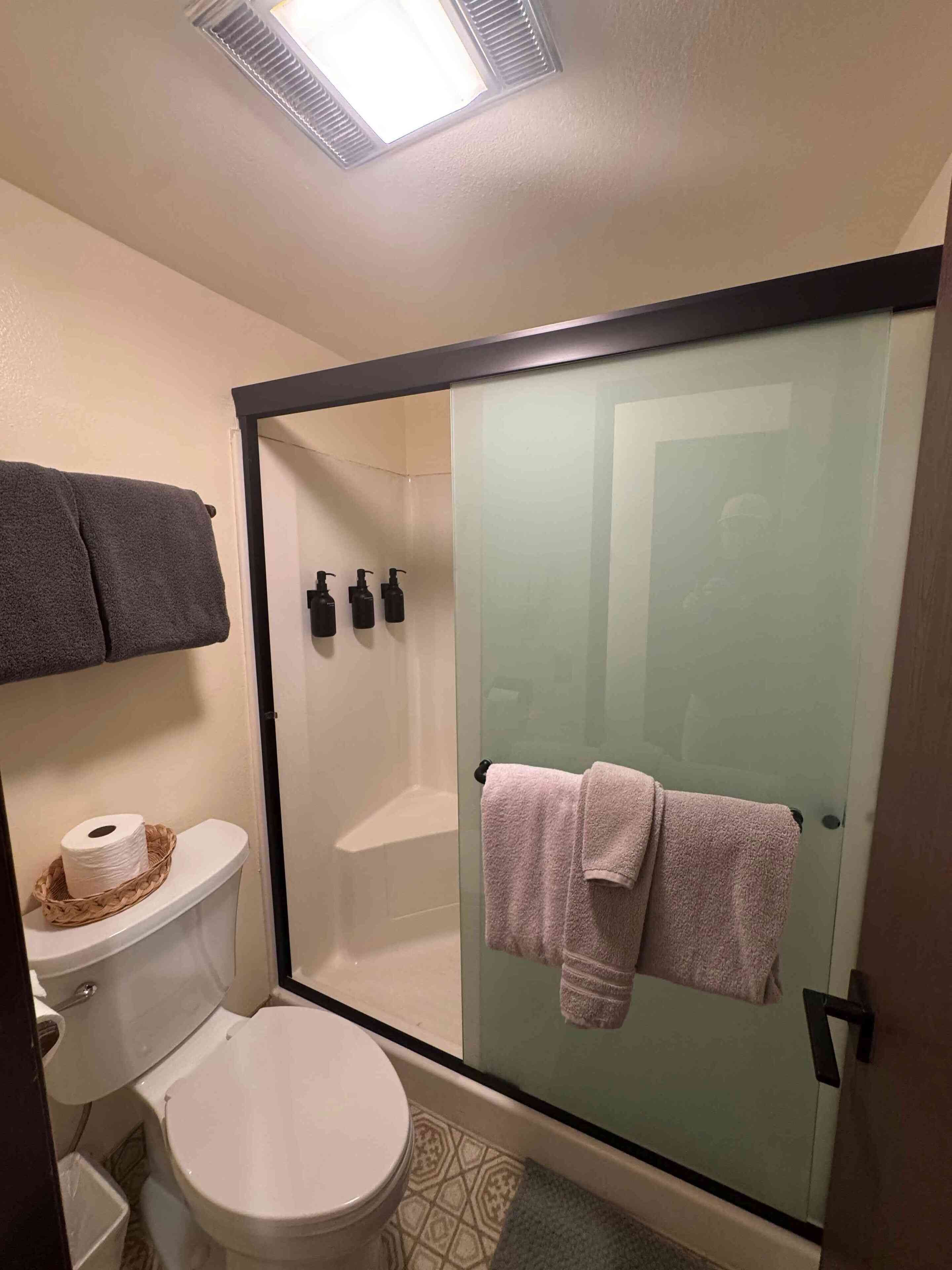 Shower, hair dryer, towels, soap