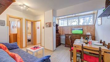 Standard Apartment, 2 Bedrooms (La Tana Dell'Ermellino 3 Ski In Ski) | Living area | 21-inch Smart TV with cable channels