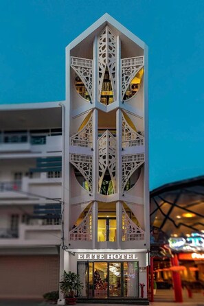A hotel with a distinctive geometric facade and multiple balconies. - The Elite Hotel (Xuan Huong - Da Lat)