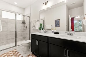 Shower, hair dryer, towels