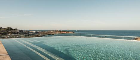 Seasonal outdoor pool, pool loungers