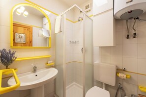 A bathroom with a white sink, a glass-enclosed shower, and a toilet. - Chaberton Romantic Retreat Ski In Ski Out (Claviere)