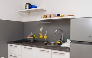 Fridge, stovetop, coffee/tea maker, cookware/dishes/utensils