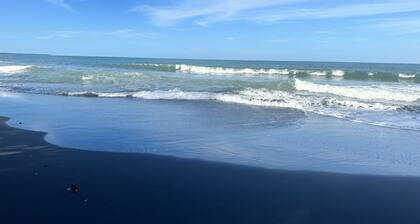 Rest , Restore, and Relax steps away from the beautiful black sands beach.