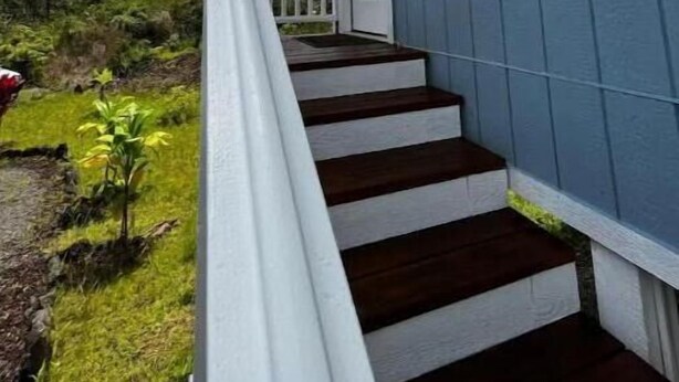 A blue house with white trim, a wooden staircase, and a white railing. - Mountain View Retreat Unit 2 - highly rated on leading vacation rental sites! (Mountain View)